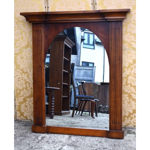 583 - A large modern pine overmantel wall mirror, 122cm by 140cm.