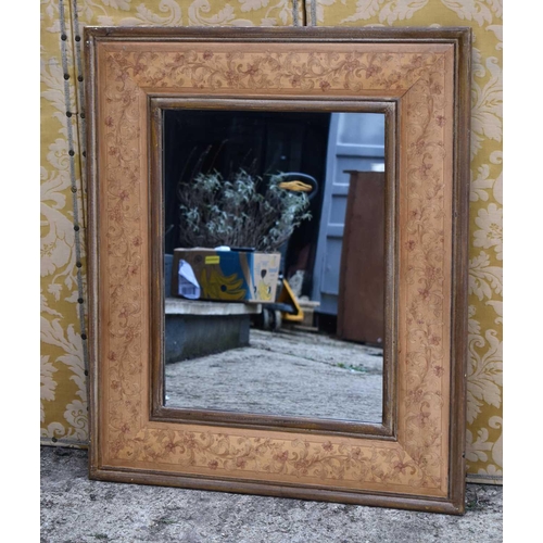 584 - A 20th century wall mirror with painted floral border, 87cm by 102cm.