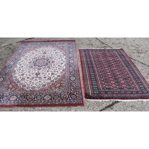 606 - A Royal Classic rug made from New Zealand wool, red ground with floral decoration, 170cm by 246cm, t... 