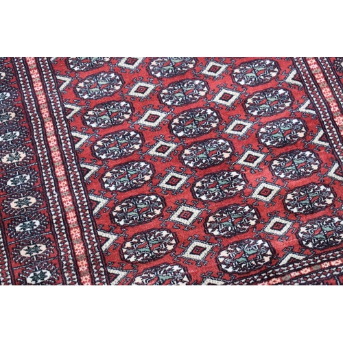 606 - A Royal Classic rug made from New Zealand wool, red ground with floral decoration, 170cm by 246cm, t... 