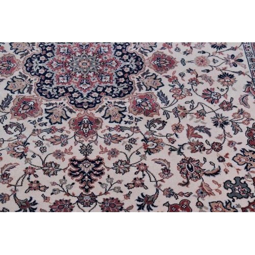 606 - A Royal Classic rug made from New Zealand wool, red ground with floral decoration, 170cm by 246cm, t... 