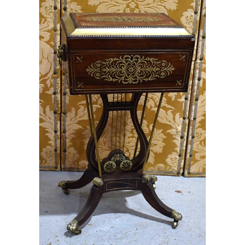 646 - A Regency rosewood and brass inlaid teapoy on stand, the sarcophagus shaped teapoy with brass beadin... 