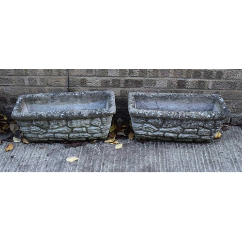 653 - Two reconstituted stone planters of rectangular form.