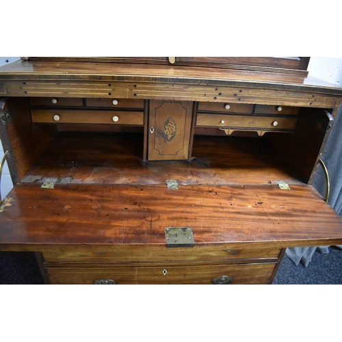 657 - A 19th century mahogany secretaire bookcase, the glazed upper section having inlaid ebonised roundel... 