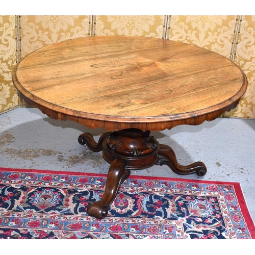 662 - A fine 19th century rosewood centre table, the circular top having a shaped apron, the base with cen... 