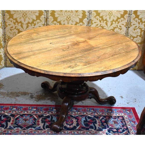 662 - A fine 19th century rosewood centre table, the circular top having a shaped apron, the base with cen... 