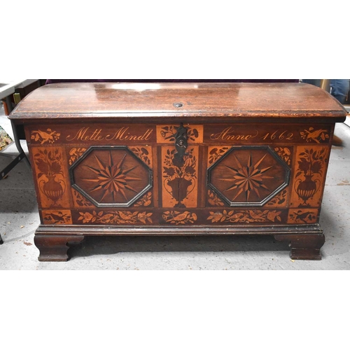 664 - An 18th century oak domed topped chest of large proportions, with later marquetry inlaid decoration,... 