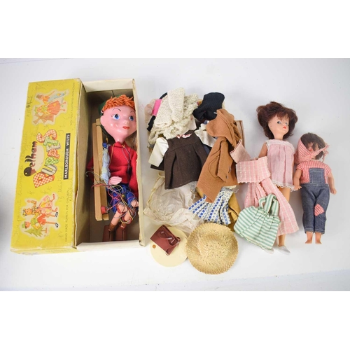 77 - A vintage Pelham puppet together with Sindy and patch dolls.