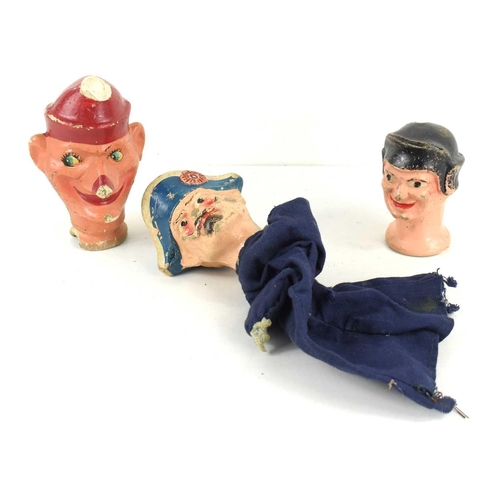 79 - An early 20th century French Gendarme finger puppet, together with two finger puppet heads.