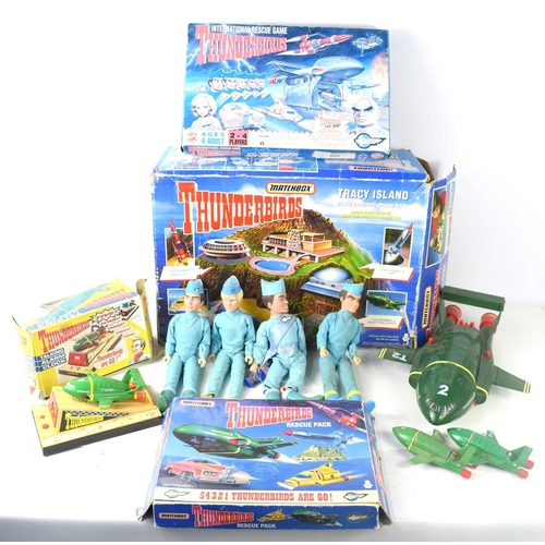 82 - A collection of Thunderbirds collectables, some vintage, to include a boxed Wesco Thunderbirds talki... 