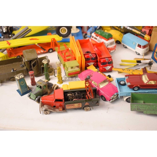 A collection of vintage toy vehicles, including various tin-plate