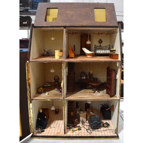 87 - A hand built wooden dolls house in the style of a traditional town house together with a quantity of... 