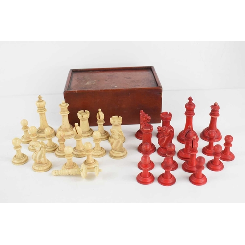 88 - A late 19th / early 20th century carved and stained bone chess set, king 7cm high, contained within ... 