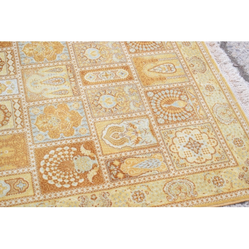 603 - A Middle Eastern rug with yellow ground, with stylised floral repeating borders, 142cms by 202cms, t... 