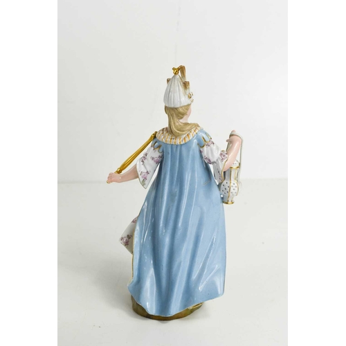 167 - A 19th century Meissen figure, allegory of the four continents representing Asia, in a blue robe, we... 