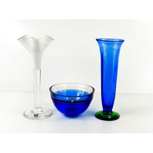 27 - Three pieces of Orrefors of Sweden glass, to include a white glass bud vase with wavy rim, a blue an... 