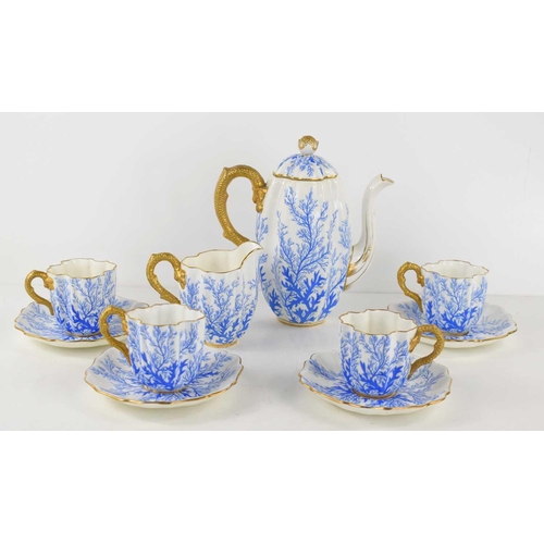 287 - A 19th century Coalport part coffee set, decorated with blue coral and gilded handles and rims.