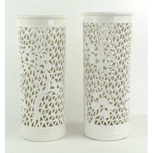 290 - A pair of mid 20th century white lamps of pierced cylindrical form, 30cm high.