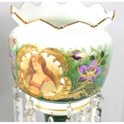 297 - A pair of Victorian glass lustres, within two glass domes, one dome a/f, each decorated with ladies ... 