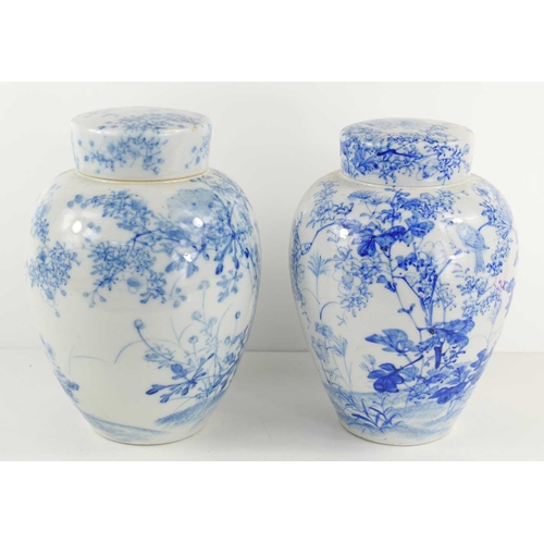 302 - Two similar Chinese blue and white ginger jars and covers, of ovoid form decorated with birds amongs... 