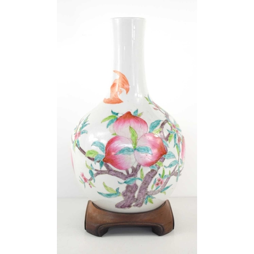 306 - A 19th century Chinese bottle form vase, depicting peaches and bats, 34cm high.