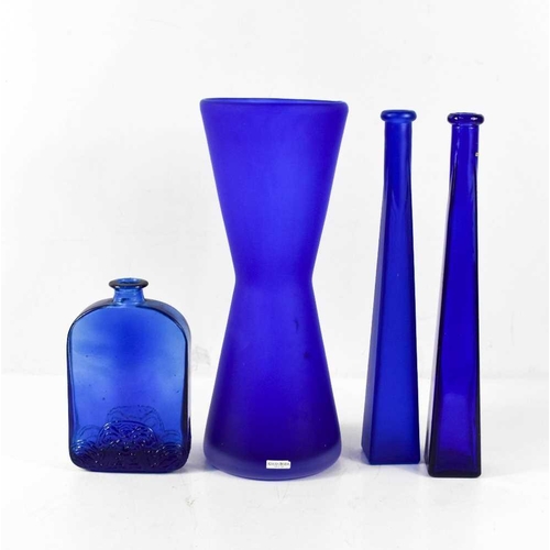 31 - An Ulrica Hydman Vallien for Kosta Boda blue glass vase, 33cm high, unsigned, together with three bl... 