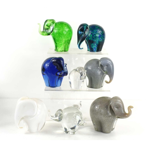 58 - A small herd of Wedgwood, Kings Lynn glass elephant paperweights, designed by Ronald Stennett-Wilson... 