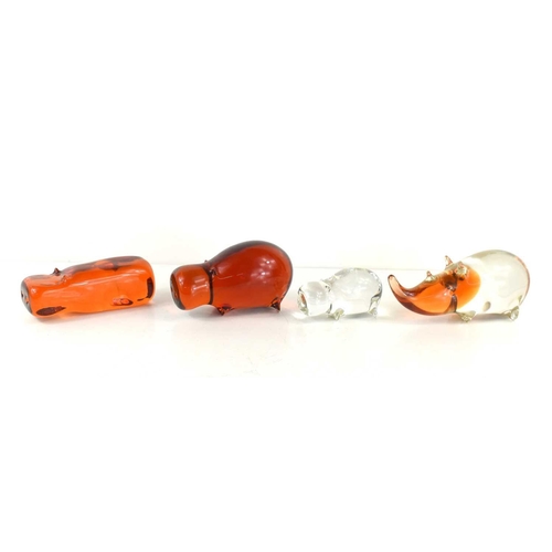 68 - A group of three Wedgewood, Kings Lynn glass hippos, comprising a large amber hippo, 7cm high, a sli... 