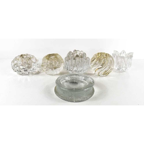 9 - Five pressed glass tealight holders, to include a 'Snowball' and a 'bubble' effect Orrefors example,... 