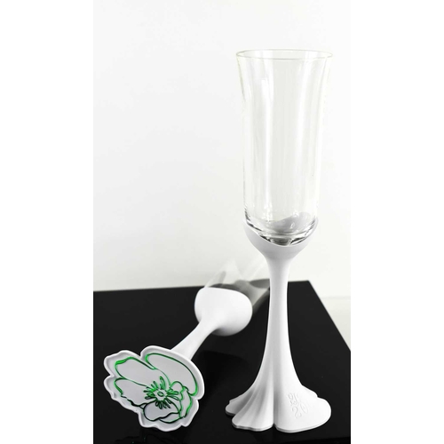 93 - A pair of Oscar de La Renta Champagne flutes, with white perspex stems stamped '200 ans', the glass ... 