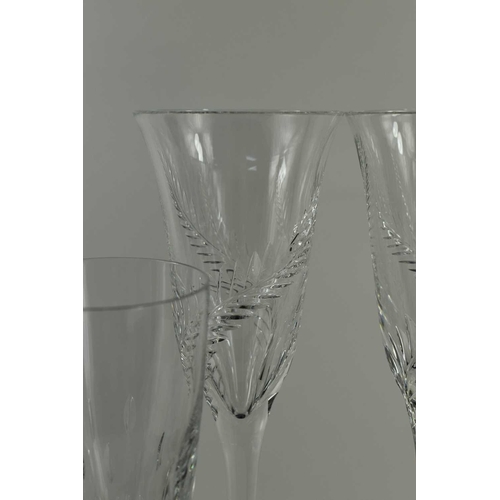 95 - A pair of fine Stuart Crystal champagne flutes, with long tapering stems and fern decoration, 31cm h... 