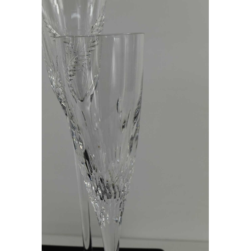 95 - A pair of fine Stuart Crystal champagne flutes, with long tapering stems and fern decoration, 31cm h... 