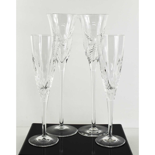 95 - A pair of fine Stuart Crystal champagne flutes, with long tapering stems and fern decoration, 31cm h... 