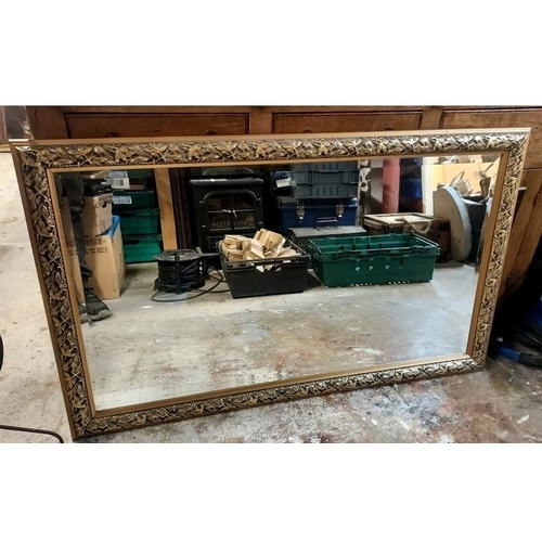 582a - A large Morris wall hanging mirror with decorated gilded frame.