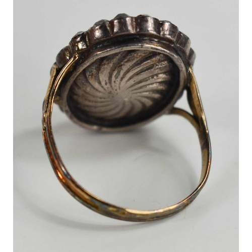 1 - A Georgian paste and enamel mourning ring, of oval form, unmarked but testing as at least 14ct gold,... 