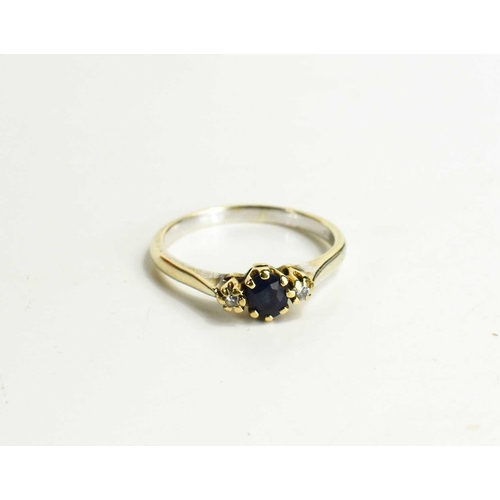 103 - A 9ct gold, sapphire and diamond three stone ring, the central sapphire of approximately 5.1mm adjoi... 