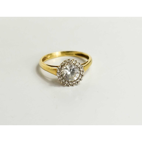 107 - A 14 ct gold and white stone ring, single stone surrounded by eighteen brilliants, size N, 2.3g.