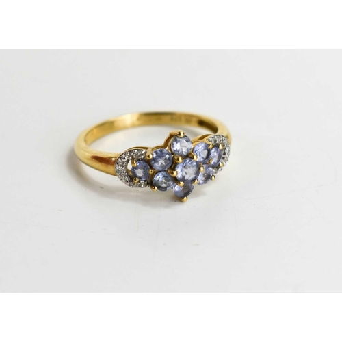 108 - A 9ct gold amethyst and diamond flowerhead ring, set with nine lavender amethysts and diamond brilli... 