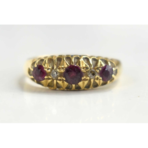 124 - An 18ct gold, ruby and diamond five stone ring, size N, 2.7g.