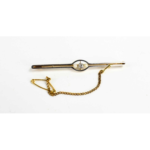 126 - An 18ct gold, diamond and seed pearl bar brooch, the white gold faced setting with two seed pearls a... 
