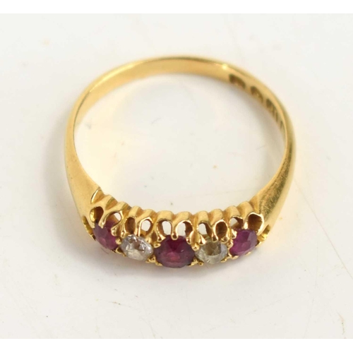 135 - An 18ct gold, ruby and diamond five stone ring set with three rubies, two diamonds, size N, 2.6g.
