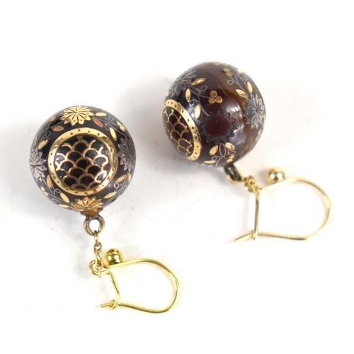 137 - A pair of early 19th century gold ball earrings, the ball drops inlaid with gold flowers, and fish s... 