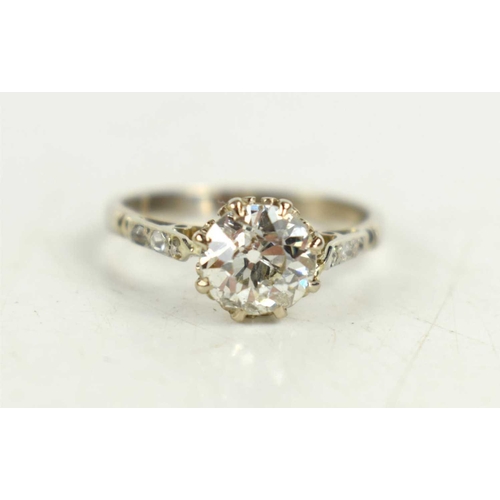 154 - An 18ct white gold solitaire ring, with old cut diamond set to the shoulders, on a platinum shank, d... 