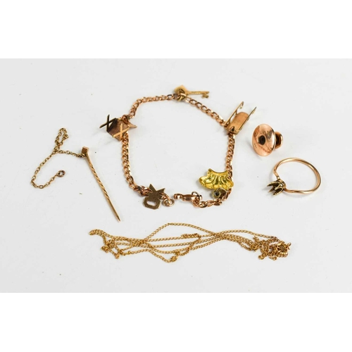 155 - A 14k rose gold collar stud, a 10kt gold charm bracelet, with five charms, and scrap gold unmarked b... 