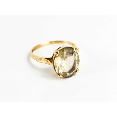 164 - A 9ct gold and smoky quartz ring, size M, 2.46g.