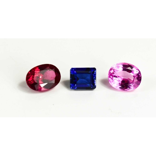 169 - A group of loose gemstones: emerald cut blue sapphire, oval cut pink sapphire and oval cut ruby, 16c... 