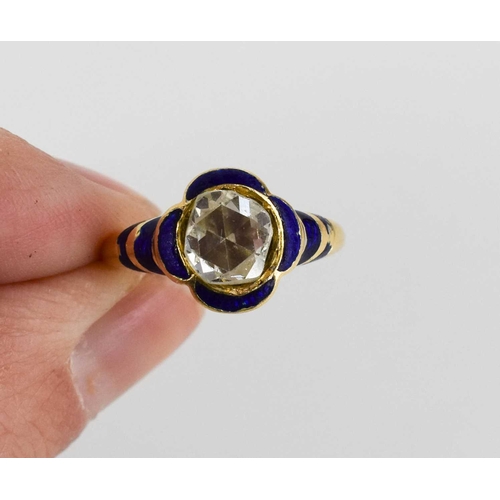 18 - A gentleman's gold, diamond and enamel ring, with curved quatrefoil blue enamel surround to a bevel ... 