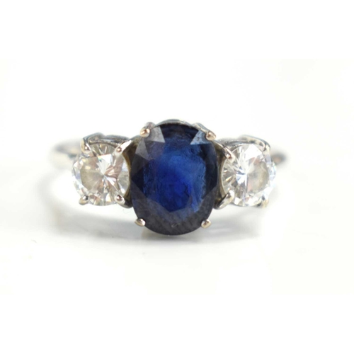 19 - An 18ct white gold, diamond and sapphire three stone ring, each diamond of approximately 0.5ct, 4.82... 