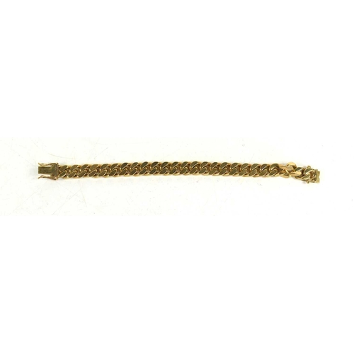 21 - A 9ct gold curb link bracelet, 50.8g.