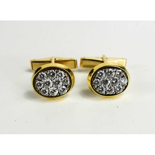 22 - A pair of 18ct gold and diamond cufflinks by Kutchinsky, each of oval form, set with ten diamonds, l... 